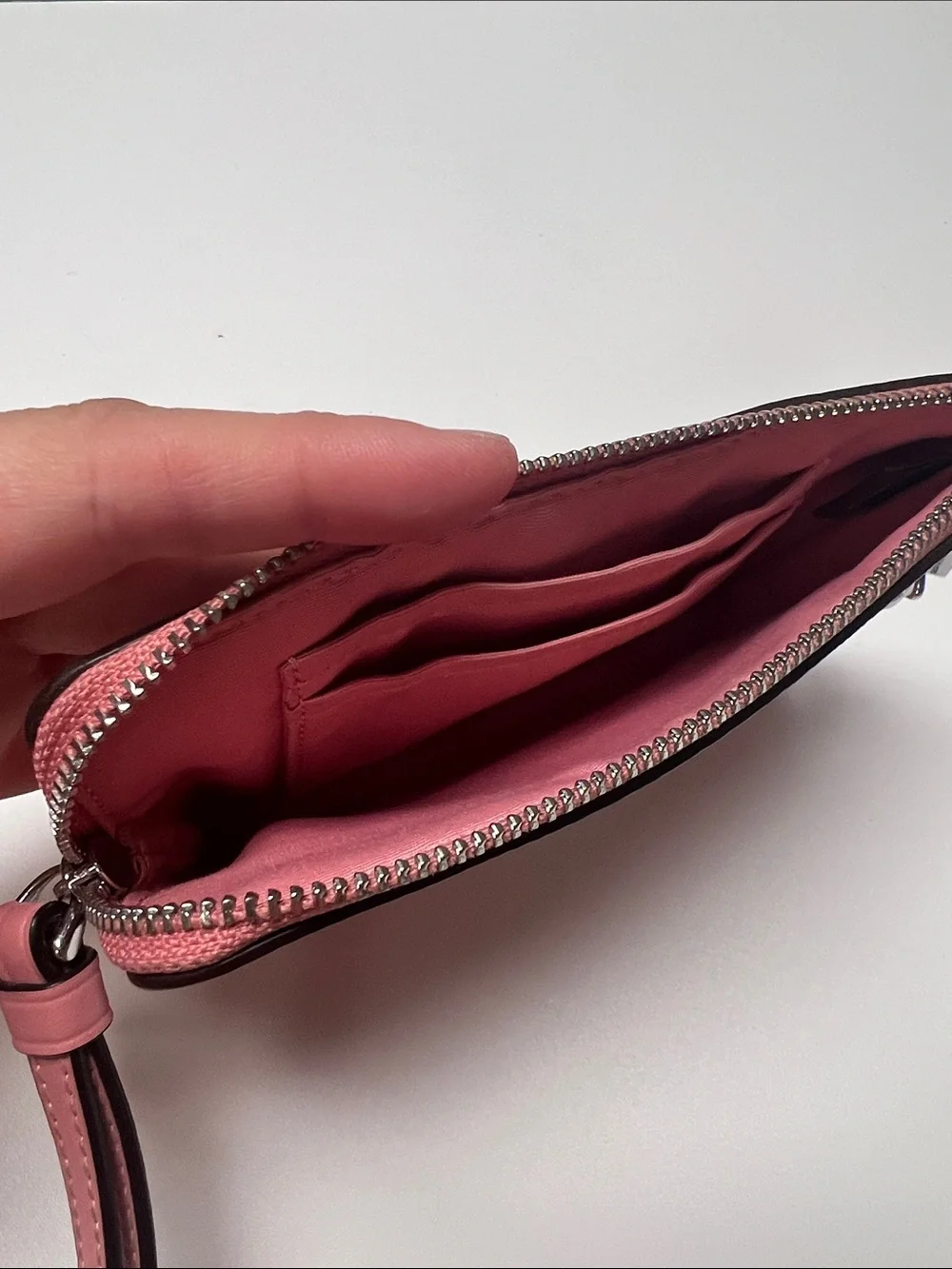 Coach Coral Pink Floral Wristlet with Silver Charm